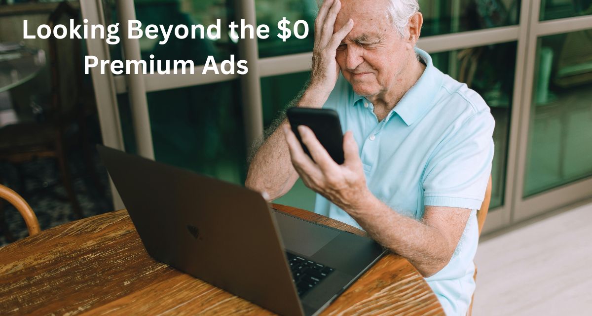 A senior couple looking confused and stressed while reviewing medical bills and a zero dollar premium Medicare advertisement.